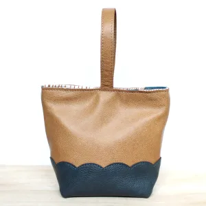 scalloped wristlet: buff tan/pebbled dark stone blue